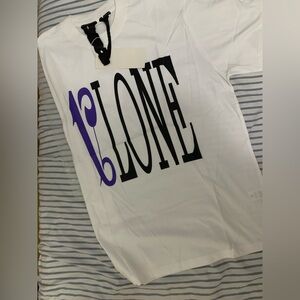White T-Shirt with Bold Black and Purple Graphic
vlone